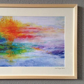 Gerahmter Kunstdruck eines farbigen Sonnenuntergangs